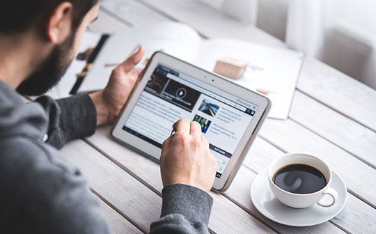 Man Reading Touchscreen Blog Digital Tablet